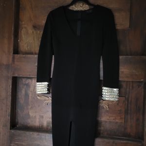 Black dress with rhinestone cuff sleeves.